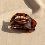 Amber clip on linen - detail shot