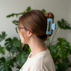 Auburn hair with blue claw clip