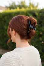 Auburn twisted bun with cream sweater