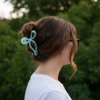 Chestnut brown side view with mint blue bow