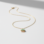 Cloud necklace on white surface