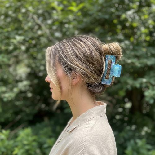 Honey blonde balayage with blue claw clip