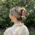 Honey blonde balayage with leopard clip in sand linen