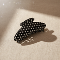 Medium black polka dot hair claw clip on cream linen