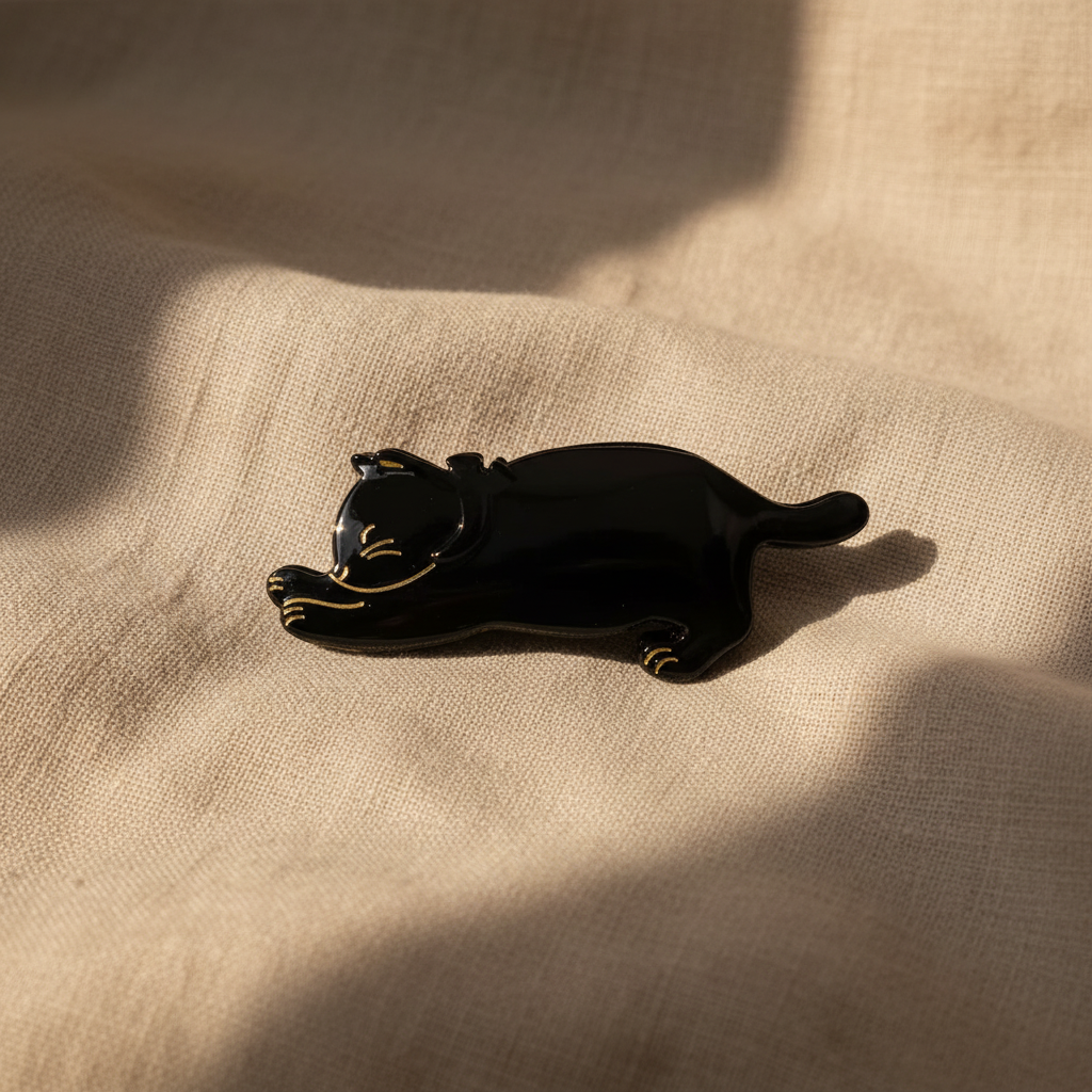 Black cat hair claw clip on natural linen