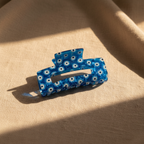 Cobalt blue evil eye hair claw clip on natural linen