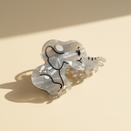 Elephant hair claw clip on warm ivory background