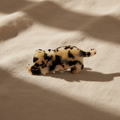 Cow print cat hair claw clip on natural linen