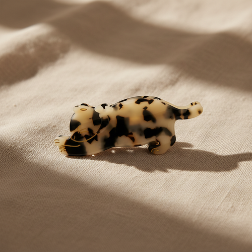 Cow print cat hair claw clip on natural linen
