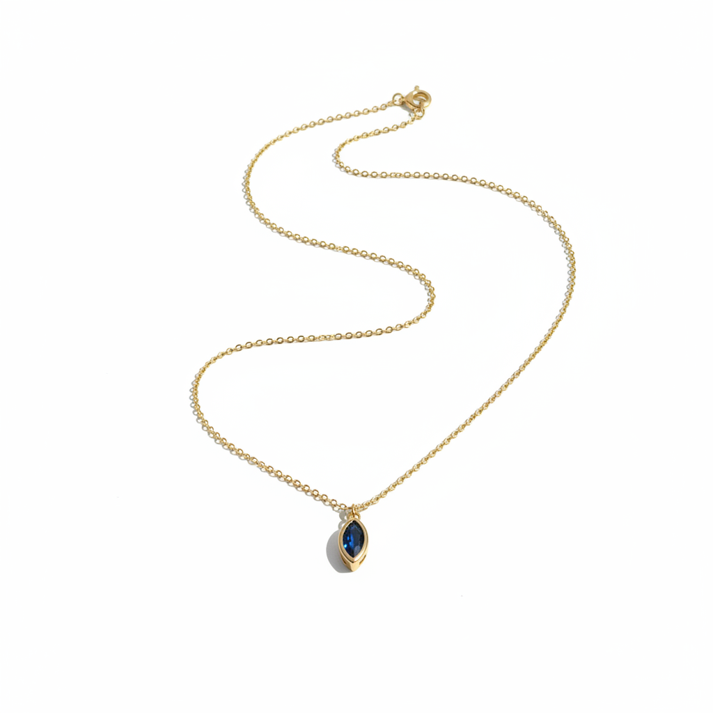 Minimalist flat lay of blue gemstone necklace on white background