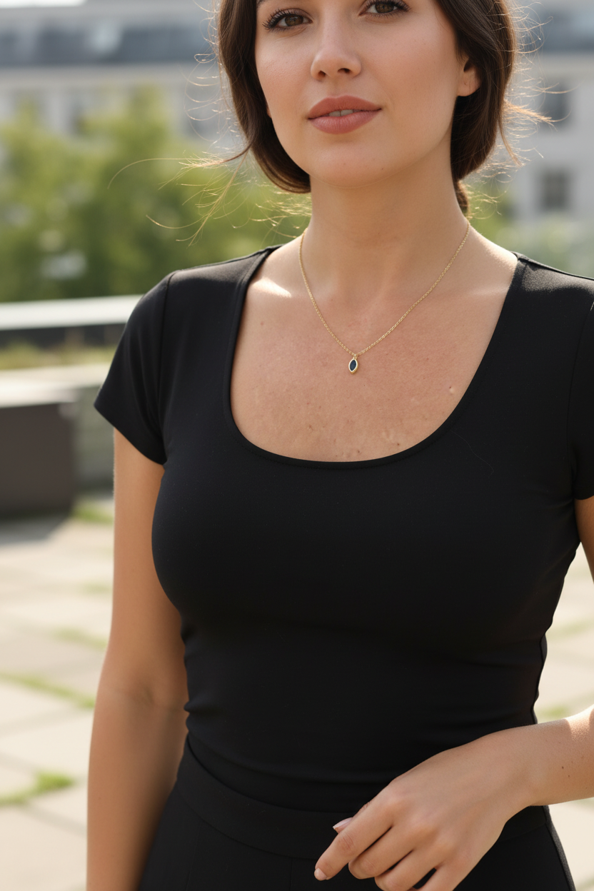 Blue gemstone necklace styled with neutral outfit