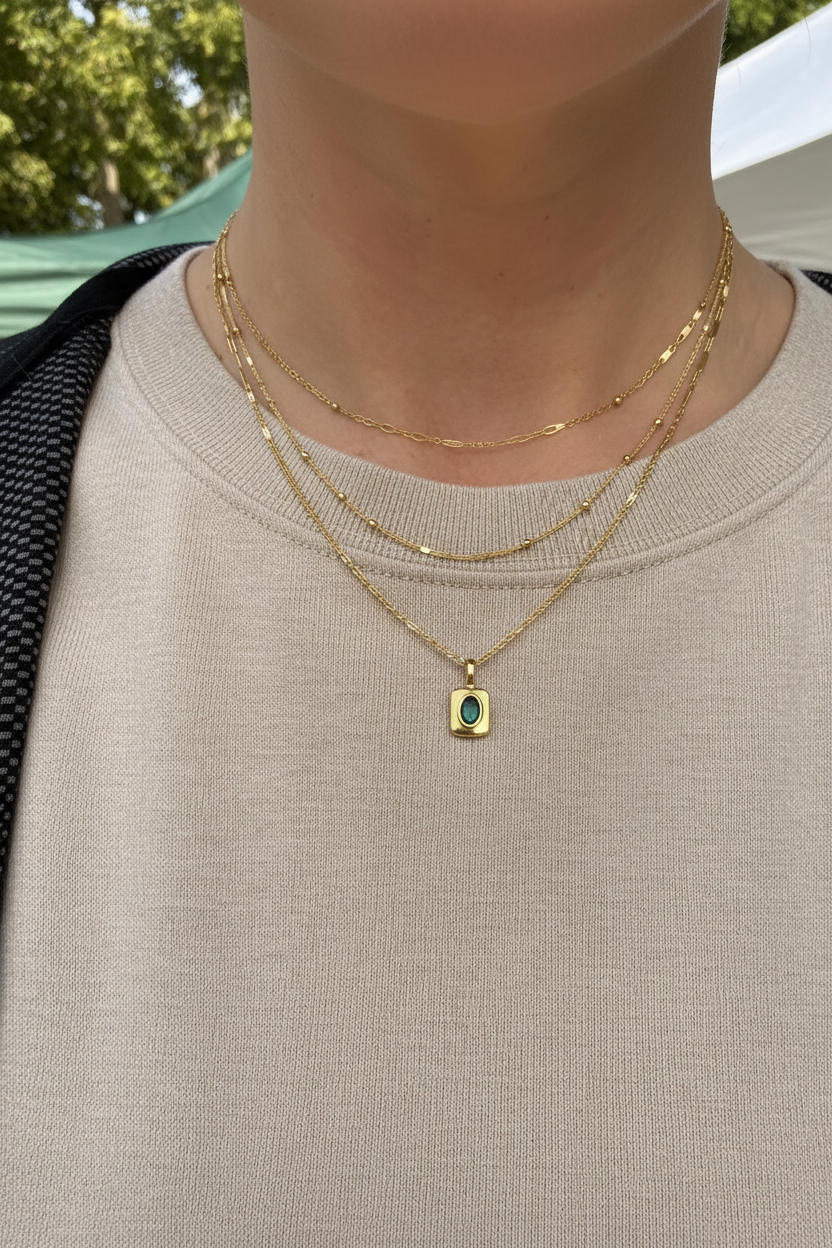 Necklace layered with other chains