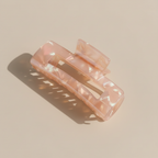 Peach claw clip neutral surface
