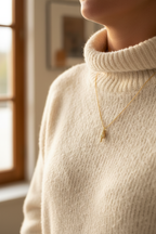 Person in cream sweater