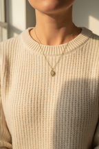 Person in cream sweater