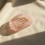 Pink showing iridescence on cream cotton