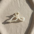 Polka dot bow on oatmeal linen