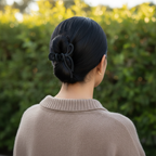 Sleek black hair with black bow clip