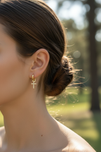 Small earrings in outdoor daylight