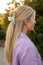 Straight blonde with lavender blouse