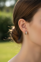 Very small earring close-up outdoors