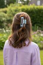 Wavy brown half-up with lavender blouse