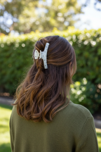 Wavy brown half-up with olive sweater