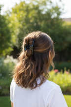 Wavy brown half-up with white tee