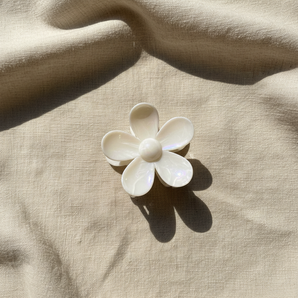 White flower clip on beige linen